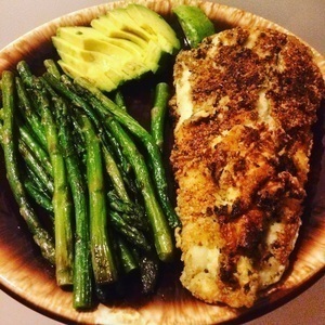 Almond flour crusted halibut fried in coconut oil with a side of asparagus and avocado 